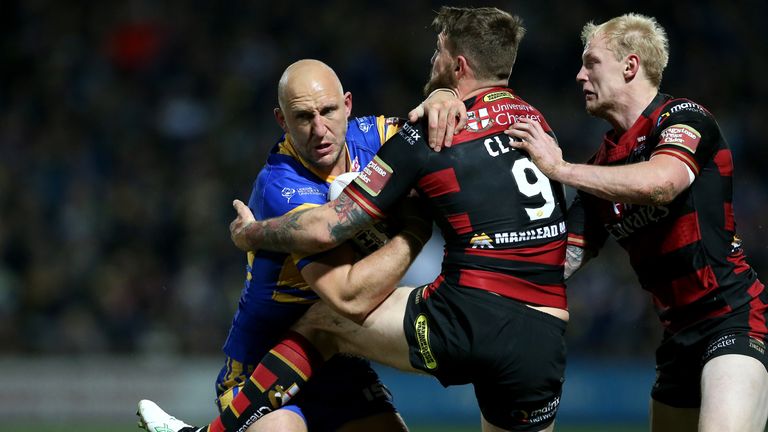 Leeds Rhinos' Carl Ablett is tackled by Warrington Wolves' Daryl Clark and Rhys Evans, Super League