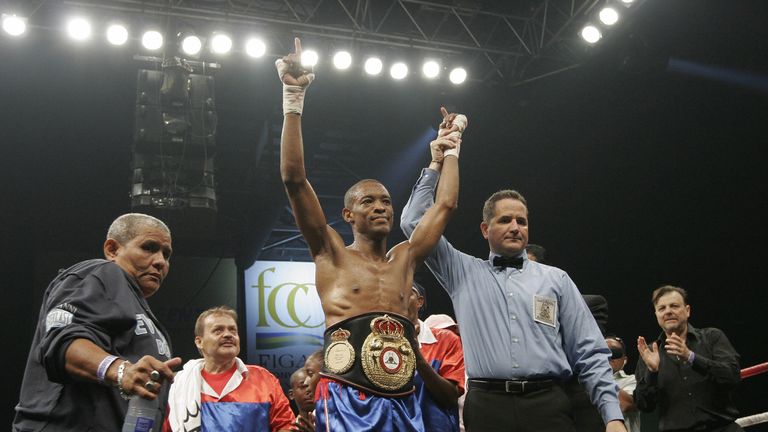 Celestino Caballero (L) celebrates defending his WBA Super Bantamweight belt against Elvis Mejia