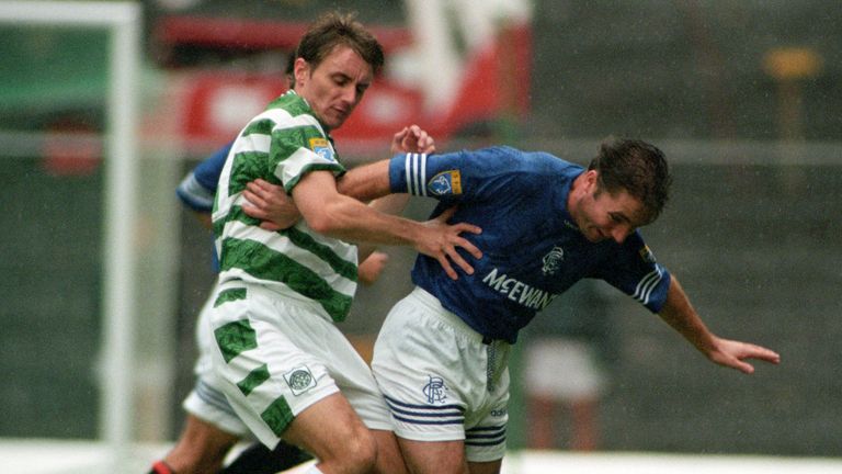 Tom Boyd challenges Rangers striker Ally McCoist in 1995