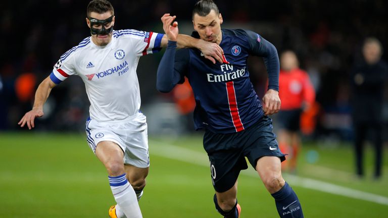 Chelsea's Cesar Azpilicueta, left, challenges for the ball with PSG's Zlatan Ibrahimovic 