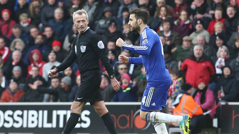 Chelsea's Spanish midfielder Cesc Fabregas (R) celebrates scoring an equalising goal to make the score 1-1 against Southampton