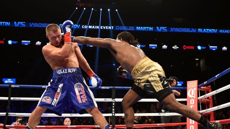 Vyacheslav Glazkov of the Ukraine (L) defends against Charles Martin of the US (R)