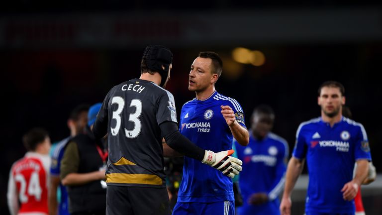 John Terry of Chelsea speaks with Petr Cech of Arsenal 