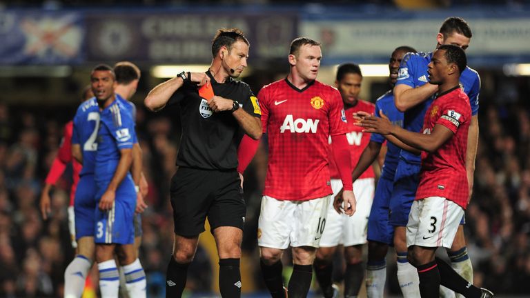 LONDON, ENGLAND - OCTOBER 28:  Referee Mark Clattenburg puts his red card away after sending off Branislav Ivanovic of Chelsea during the Barclays Premier 