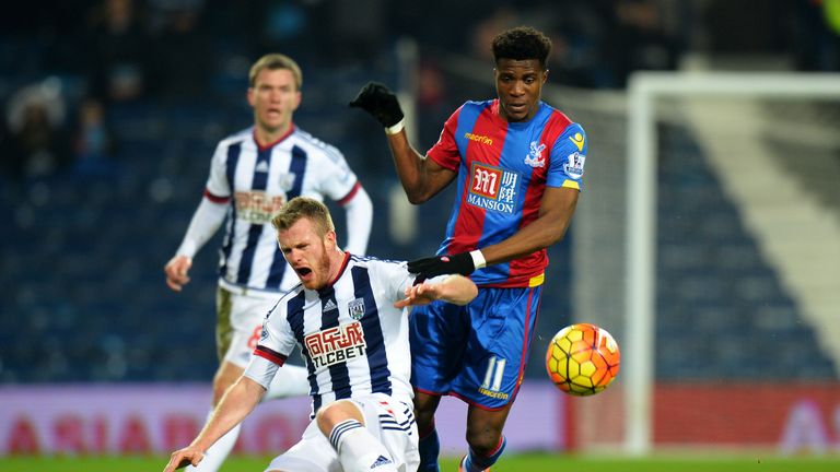 Chris Brunt competes for the ball against Wilfried Zaha  resulting in an injury