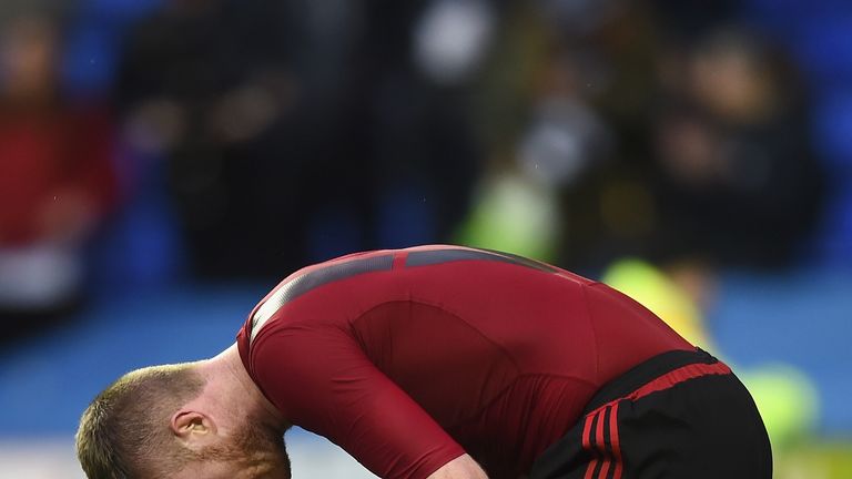 Chris Brunt of West Bromwich Albion reacts after being hit by an object during the Emirates FA Cup fifth round match at Reading