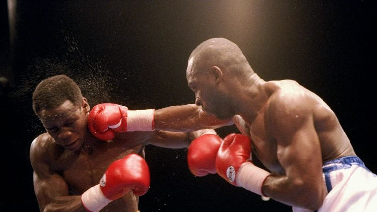 Chris Eubank (left) trades blows with Nigel Benn. Mandatory Credit: Holly Stein  /Allsport