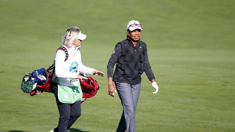 Former Secretary of State Condoleezza Rice walks down the fairway on the  10th hole during the first round of the AT&T Pebble Beach National Pro-Am