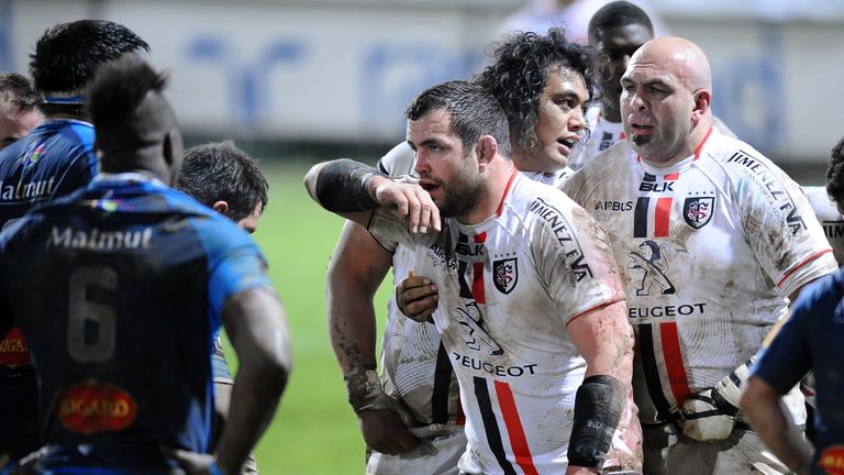Toulouse's first raw Corey Flynn (C), Gurthro Steenkamp (R) and Samoan prop Census Johnston (2ndR) face Castres