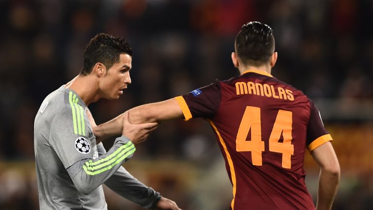 Cristiano Ronaldo vies with Kostas Manolas during the UEFA Champions League football match AS Roma vs Real Madrid at the Olympic Stadium in Rome