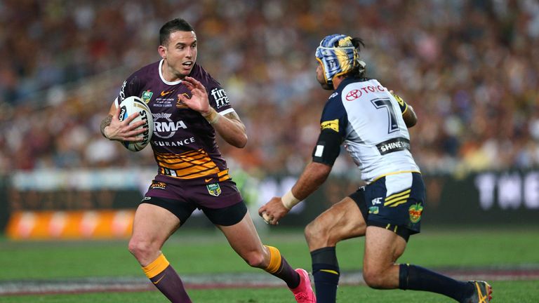 Darius Boyd of the Broncos is tackled during the 2015 NRL Grand Final match between the Brisbane Broncos and the North Que