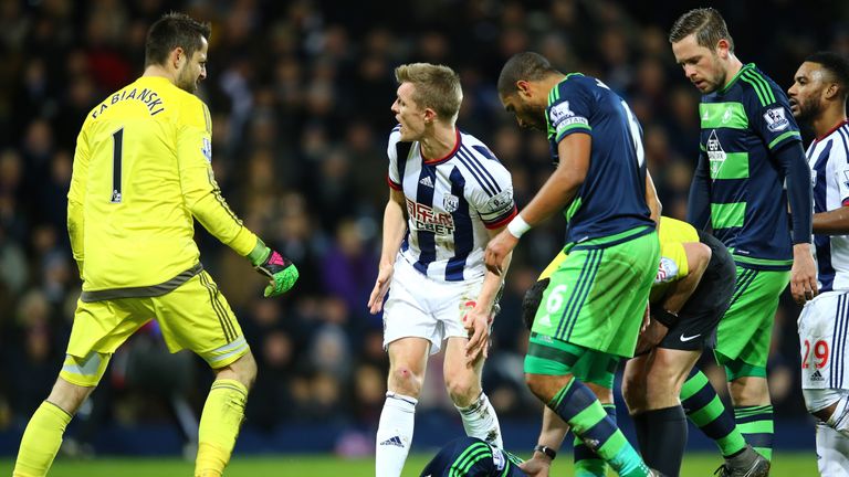 Fletcher stands over Ki Sung-Yeung after the Swansea player went down with a head injury