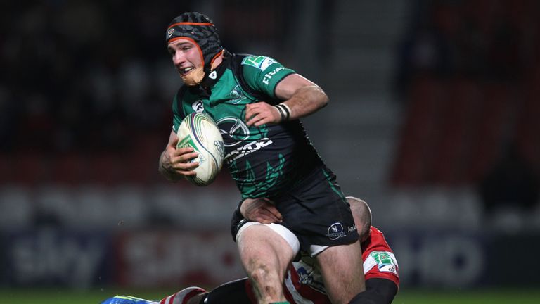 GLOUCESTER, ENGLAND - DECEMBER 17:  Dave McSharry of Connacht Rugby is held up by Charlie Sharples of Gloucester during the Heineken Cup Pool Six match bet