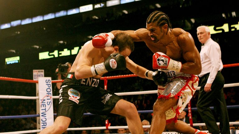 David Haye (R) exchanges punches with Enzo Maccarinelli during the Unified World Cruiserweight title at the O2 Arena March 9, 