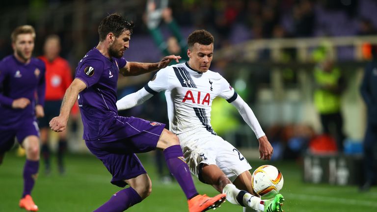 FLORENCE, ITALY - FEBRUARY 18:  Dele Alli of Tottenham Hotspur and Nenad Tomovic of Fiorentina compete for the ball during the UEFA Europa League round of 