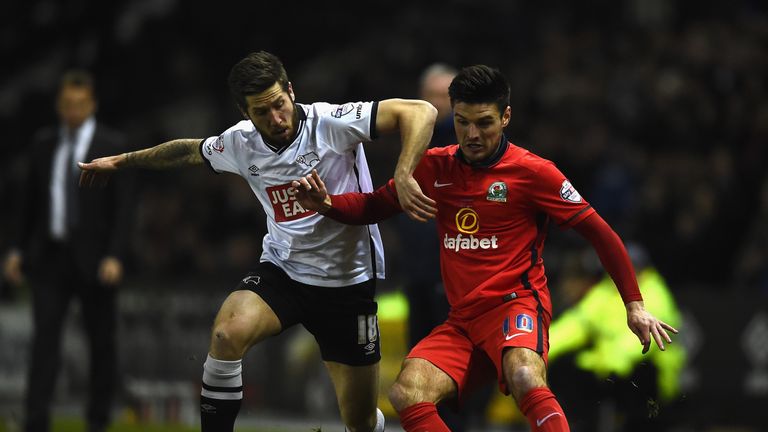 Jacob Butterfield battles for the ball with Ben Marshall
