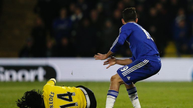 Watford's Juan Carlos Paredes (L) goes down after a tangle with Chelsea's Diego Costa
