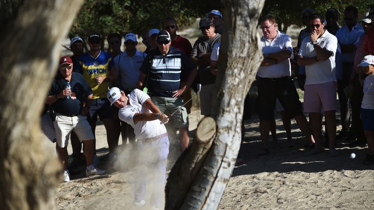 Andy Sullivan hit his drive into the sand on the 16th hole and finished with an unlikely birdie during the third round of the Omega Dubai Desert