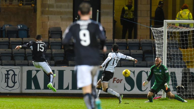Kane Hemmings lashes home his second on a night when persistent rain lashed down at Dens Park
