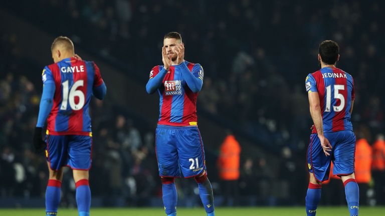 Dwight Gayle, Connor Wickham and Mile Jedinak of Crystal Palace look dejected after the Premier League defeat at West Brom