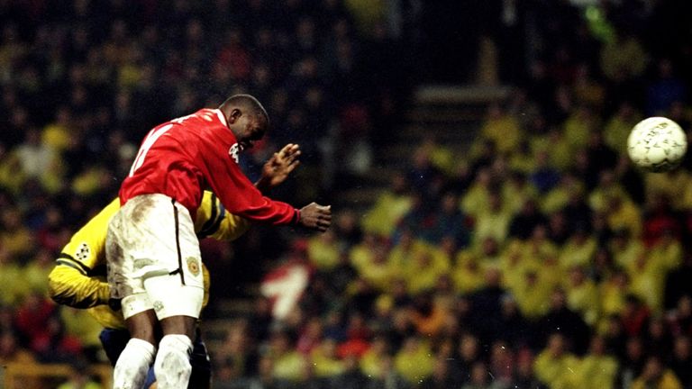 Dwight Yorke rises to score Manchester United's 5th goal against Brondby during the UEFA Champions League match at the Parken Stadium in Copenhagen