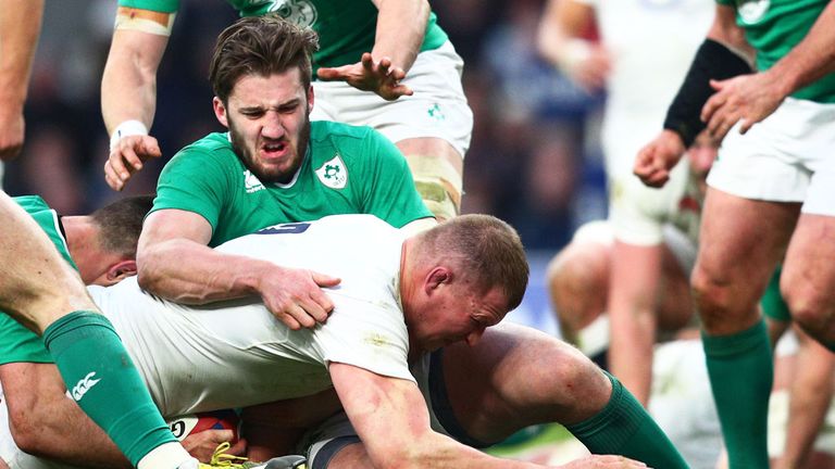 England captain Dylan Hartley is challenged on the try line during the match against Ireland