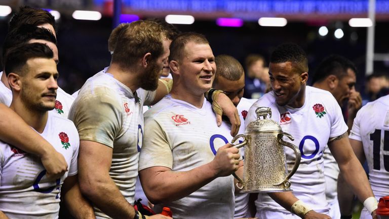 Dylan Hartley the England captain (c) and team mates James (2nd l) and Anthony Watson (r) celebrate with the Calcutta Cup