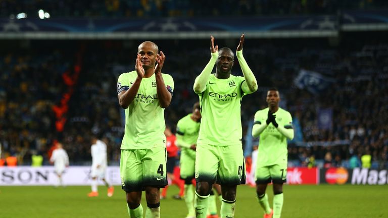 Vincent Kompany and Yaya Toure of Manchester City applaud the travelling fans following their team's 3-1 victory at Dynamo Kiev, Champions League