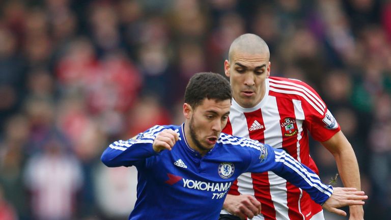 Eden Hazard of Chelsea controls the ball under pressure of Oriol Romeu of Southampton