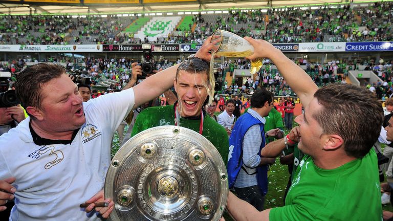 Edin Dzeko is drenched with beer after Wolfsburg win the Bundesliga in 2009