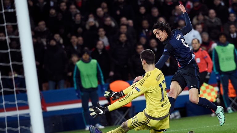 Paris Saint-Germain's Uruguayan forward Edinson Cavani (R) scores a goal past Chelsea's Belgian goalkeeper Thibaut Courtois