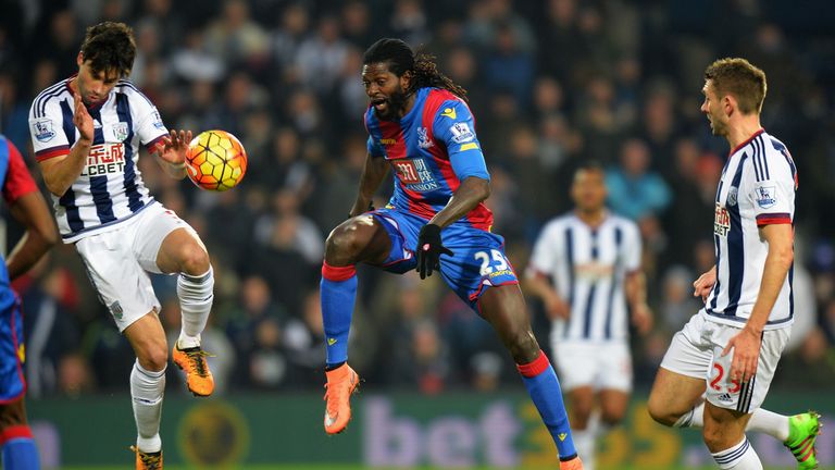 Emmanuel Adebayor of Crystal Palace and Claudio Yacob of West Bromwich Albion compete for the ball