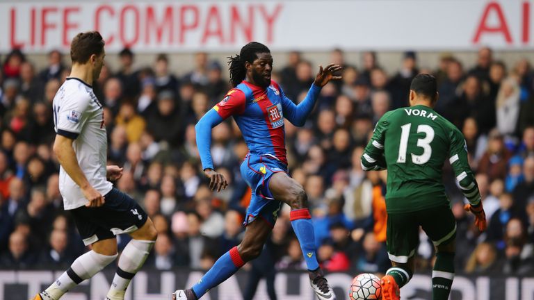 Emmanuel Adebayor of Crystal Palace goes past Tottenham goalkeeper Michel Vorm during the FA Cup fifth-round match