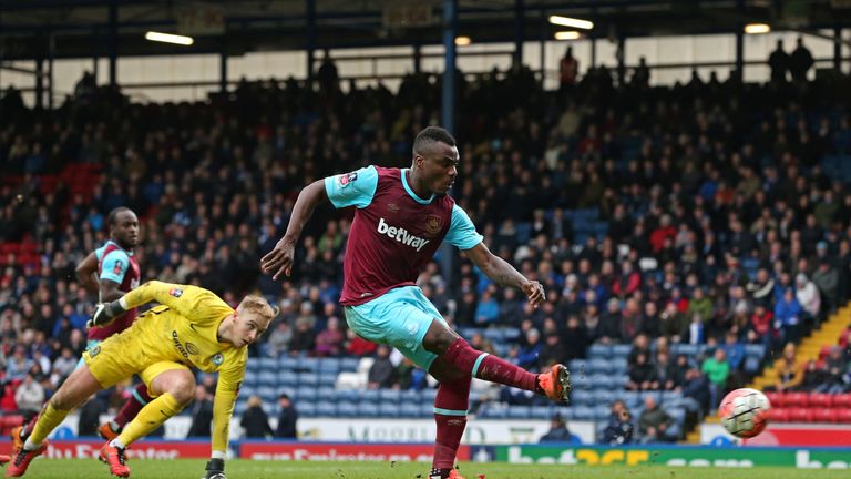 Emmanuel Emenike of West Ham United scores his team's fourth goal during the FA Cup fifth round match at Blackburn Rovers