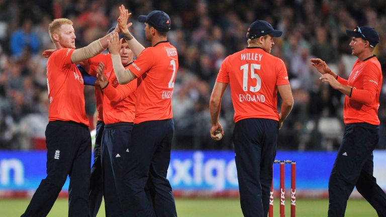 England's players celebrate the dismissal of South Africa's Hashim Amla during the first of two T20 matches being played against South Africa, at Newlands 