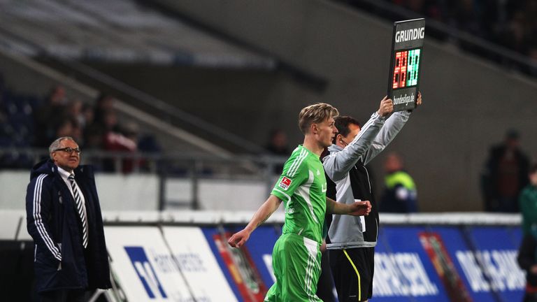 Felix Magath watches on as Sebastian Polter is introduced during the Bundesliga match between Hannover 96 and VfL Wolfsburg at AWD Arena on April 11, 2012