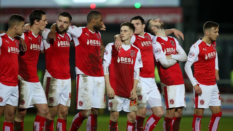 FLEETWOOD, ENGLAND - FEBRUARY 04:  Fleetwood Town players look on dejected after loosing in a penalty shoot out during the Johnstone's Paint Trophy 