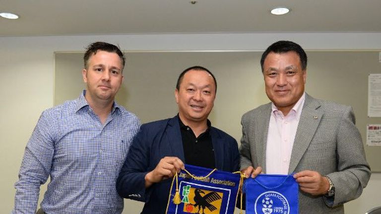 Gary White, Richard Lai, president of Guam Football Federation and Kohzo Tashima, president of Japan Football Association and FIFA vice president
