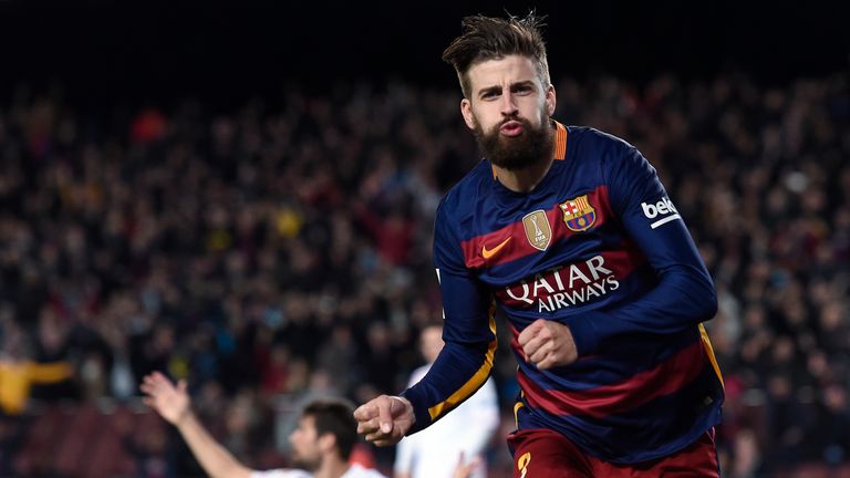Barcelona's defender Gerard Pique celebrates a goal during the Spanish league football match against Sevilla at the Nou Camp.