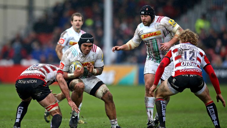 Mat Luamanu of Harlequins is tackled by Mariano Galarza of Gloucester Rugby during the Aviva Premiership match between G