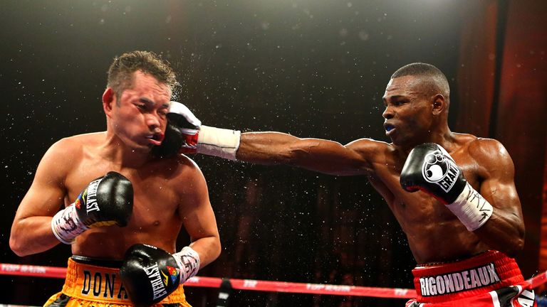  Guillermo Rigondeaux punches Nonito Donaire during their WBO/WBA super-bantamweight title unification bout