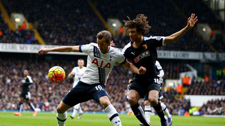 Harry Kane of Tottenham Hotspur and Nathan Ake of Watford compete for the ball