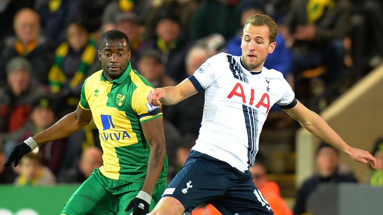 NORWICH, ENGLAND - FEBRUARY 02: Harry Kane of Tottenham Hotspur and Sebastien Bassong of Norwich City compete for the ball during the Barclays Premier Leag