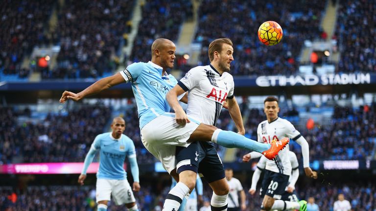 Harry Kane is challenged by Vincent Kompany