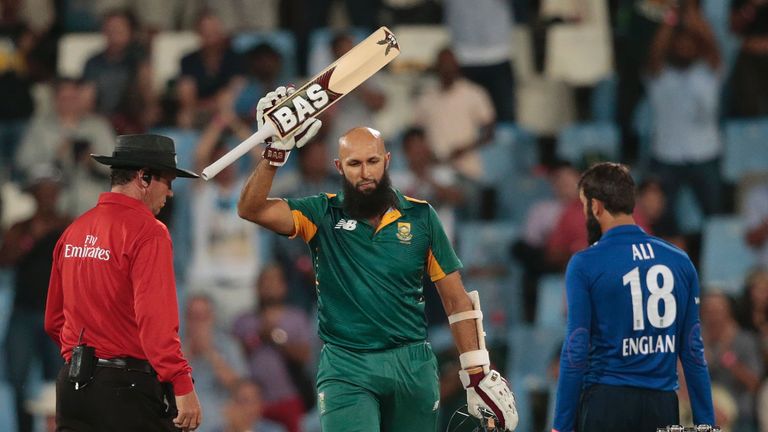 South African batsman Hashim Amla (C) celebrates after scoring a century (100 runs) 