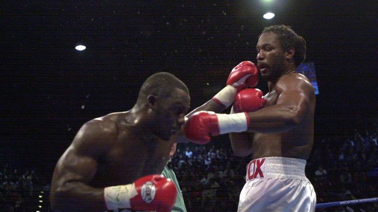 Hasim Rahman lands a jab to the face of the Lennox Lewis on his way to becoming the new heavyweight champion of the world by knocking out Len