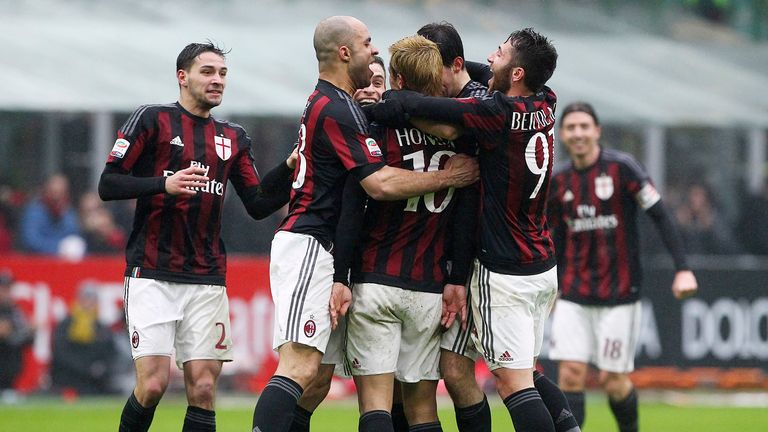 Keisuke Honda (C) of AC Milan celebrates his goal with his team-mates during the Serie A match between AC Milan and Genoa CFC 
