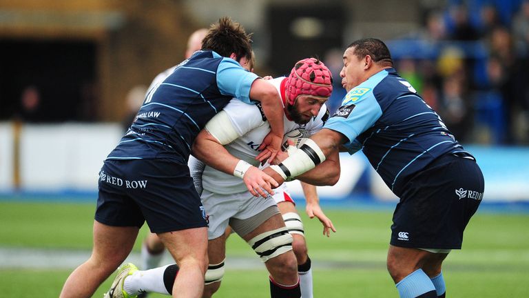 Ulster's Pete Browne is tackled by Cardiff Blues' Ellis Jenkins.
