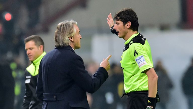 Inter Milan's Italian coach Roberto Mancini gets a red card from referee Antonio Damato against Inter Milan