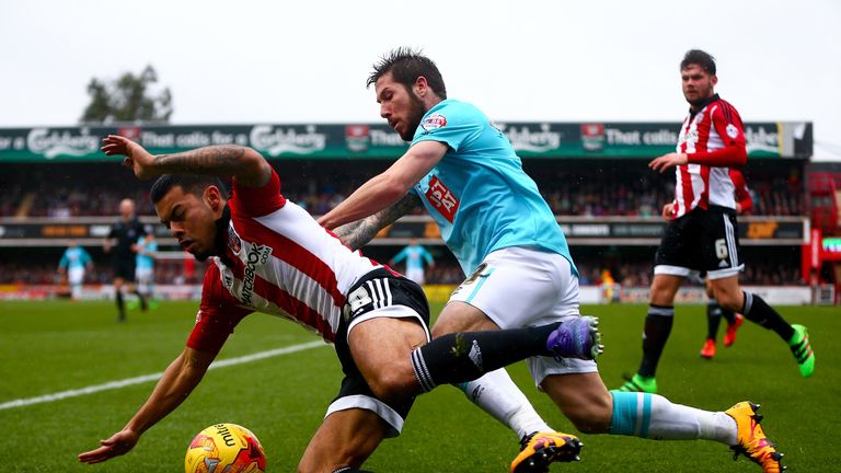 Nico Yennaris of Brentford is tackled by Derby's Jacob Butterfield 